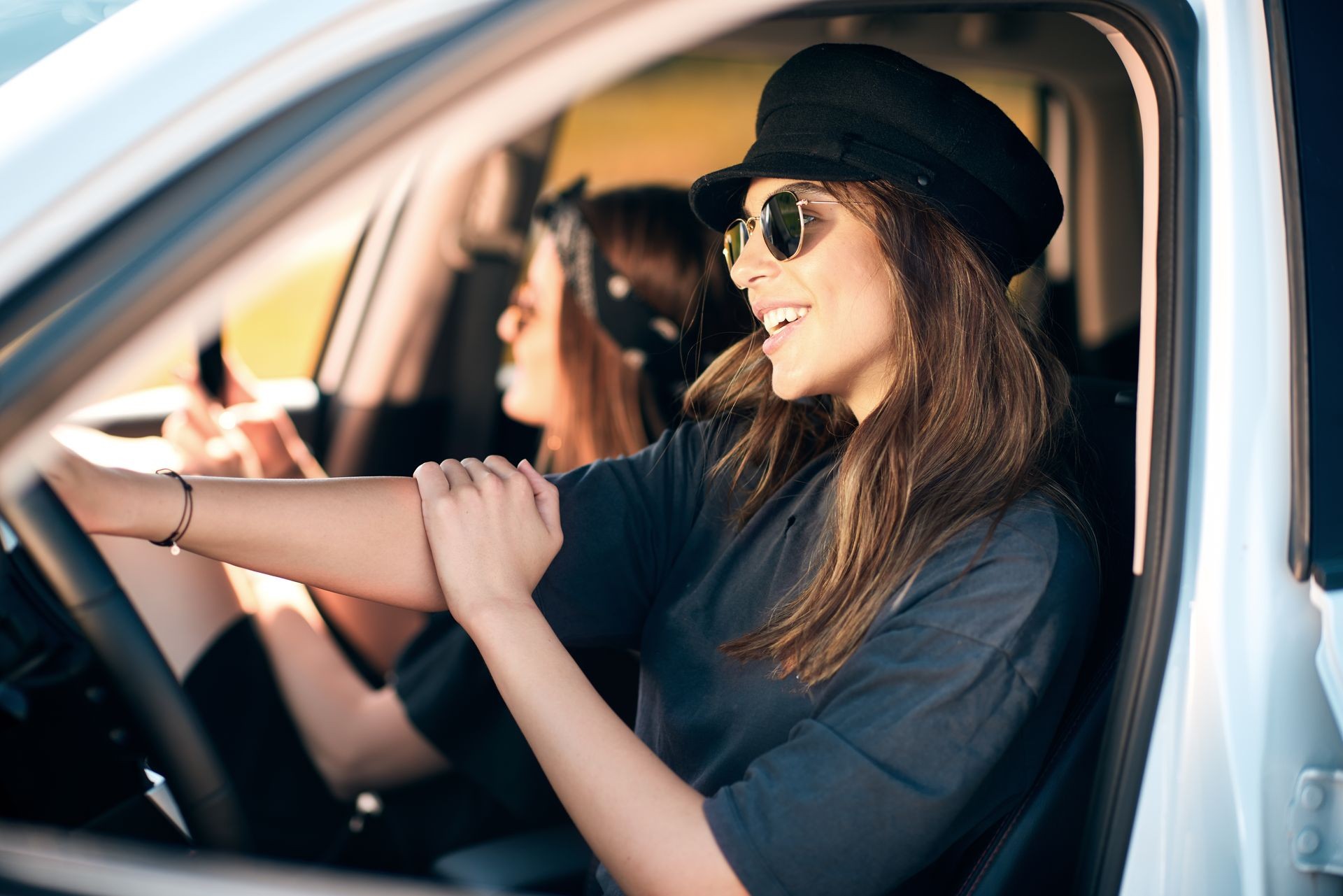 Two young women having fun on road trip Two young women having fun on road trip